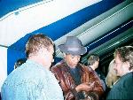 Steve Ajao checks his messages in The Charterhouse International Blues Pavilion