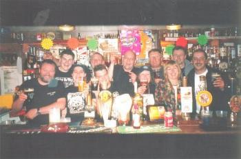 Click to enlarge photo of the Queens Hotel Festival Team celebrating 2002
